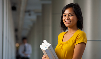 girl holding papers