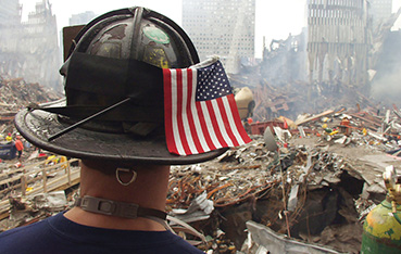 Rescue Worker with hard hat and American flag