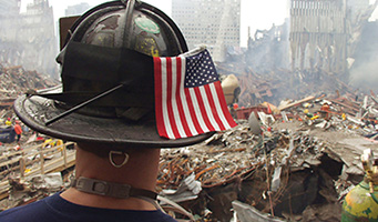 Rescue Worker with hard hat and American flag