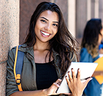 Female Student leaning on wall