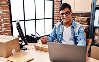 Male behind laptop